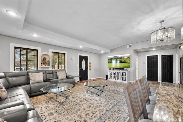 living room with a notable chandelier