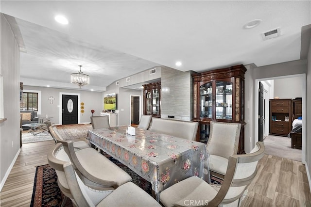 dining area with an inviting chandelier