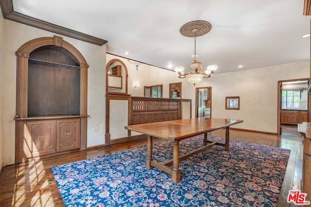 dining area featuring a notable chandelier and hardwood / wood-style flooring