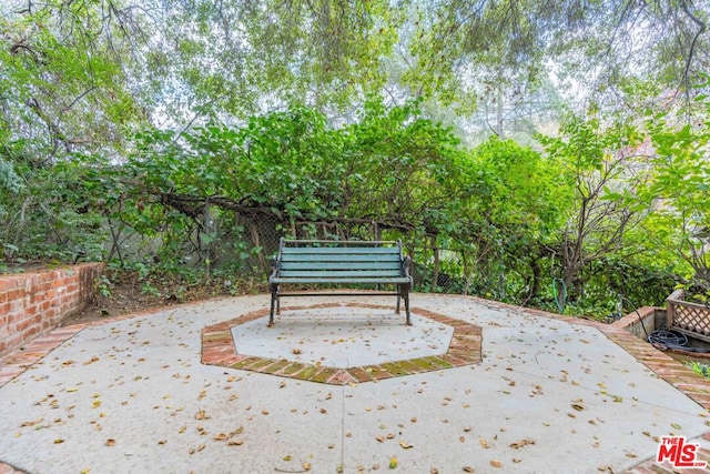 view of property's community with a patio area