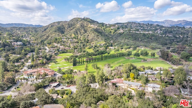 birds eye view of property with a mountain view