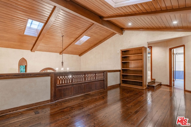 interior space featuring dark wood-type flooring, wooden ceiling, lofted ceiling with skylight, and a notable chandelier