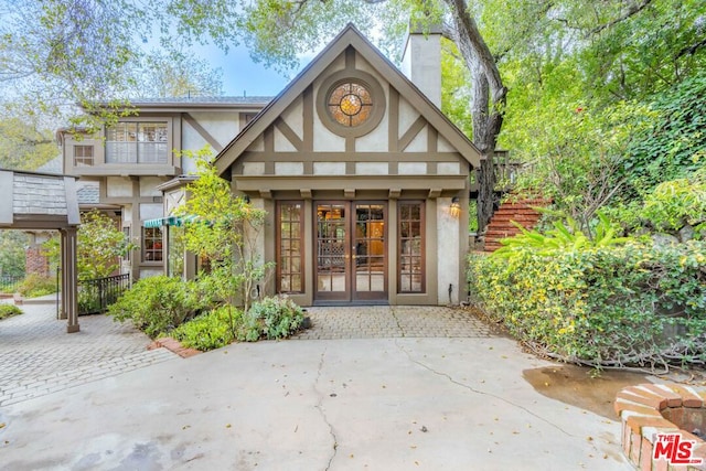 property entrance featuring french doors