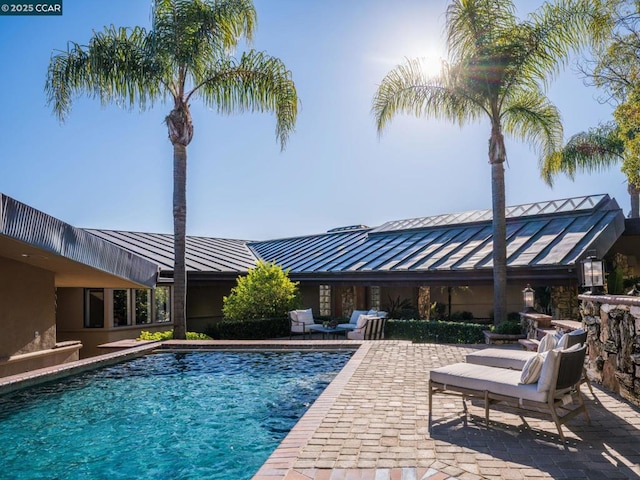 view of pool featuring a patio