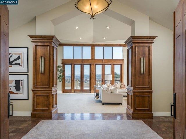 living room featuring high vaulted ceiling