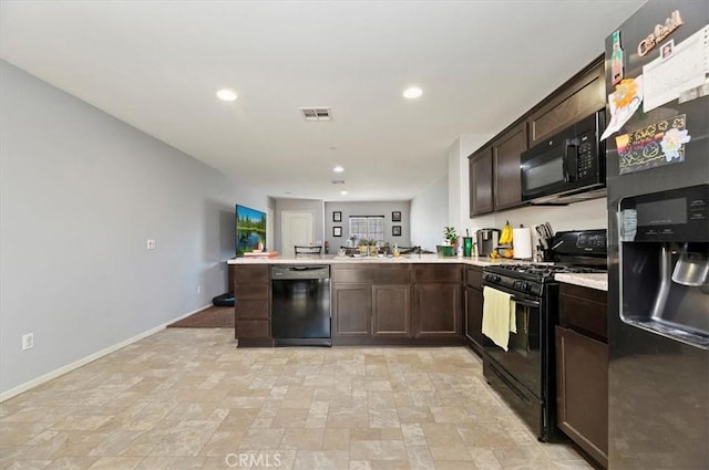 kitchen featuring dark brown cabinets, black appliances, and kitchen peninsula