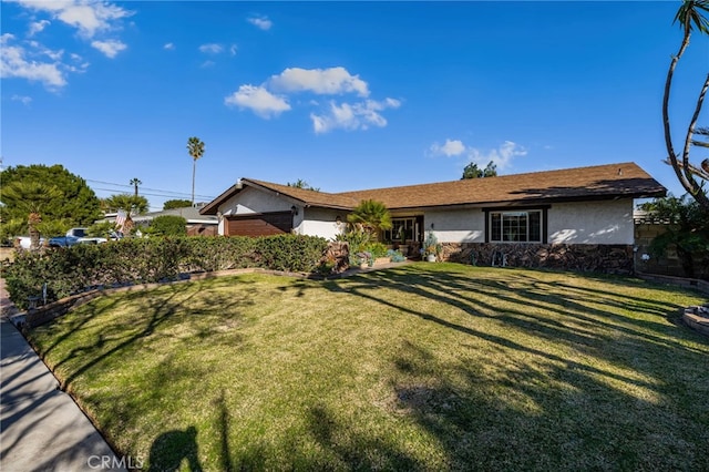 ranch-style home featuring a front yard