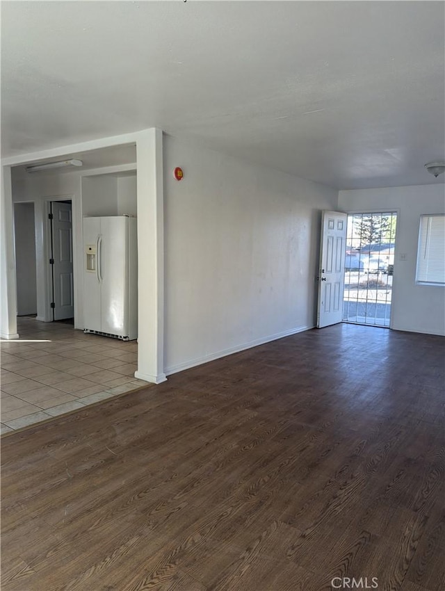 unfurnished room with hardwood / wood-style flooring