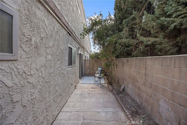 view of side of property featuring a patio