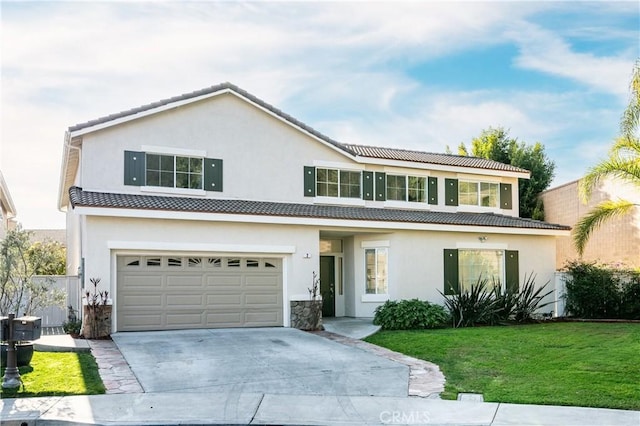 view of front of home featuring a garage and a front lawn