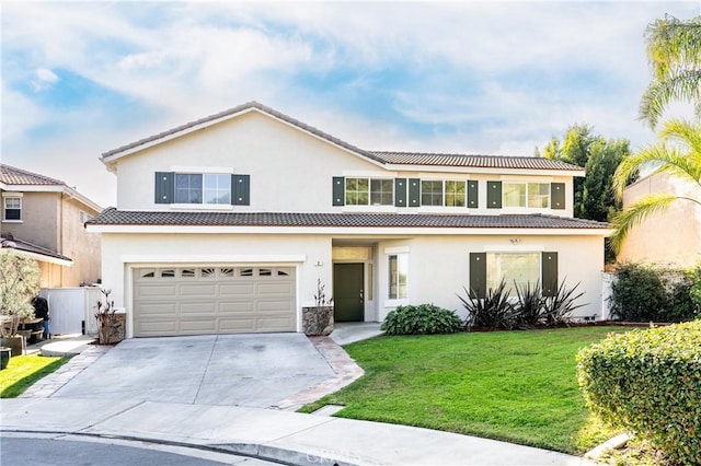 view of front of home featuring a garage and a front lawn