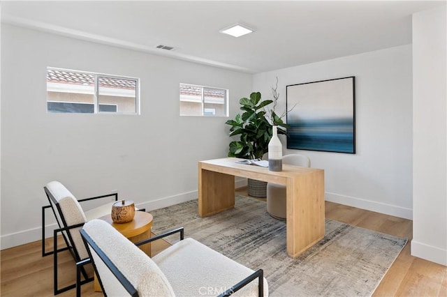 office space with light wood-type flooring