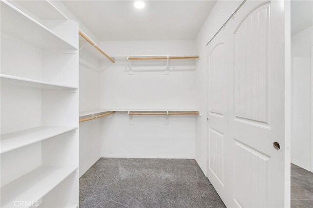 13946 Blossom Way, Eastvale, CA 92880 - walk in closet with carpet floors