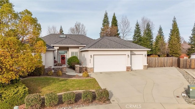 view of front of home with a garage and a front yard