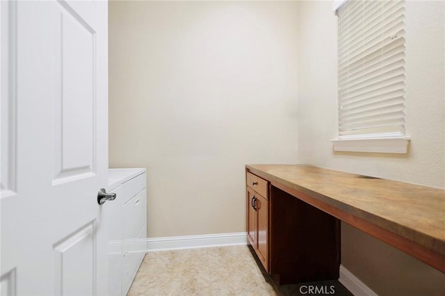 3600 Laver Ct, Redding, CA 96002 - clothes washing area featuring washer and clothes dryer, baseboards, and an office area