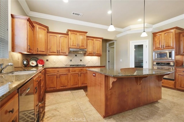 3600 Laver Ct, Redding, CA 96002 - kitchen with stainless steel appliances, a kitchen island, a kitchen breakfast bar, a sink, and under cabinet range hood