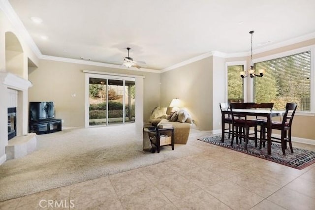 3600 Laver Ct, Redding, CA 96002 - carpeted living room with tile patterned floors, a chandelier, crown molding, baseboards, and a glass covered fireplace