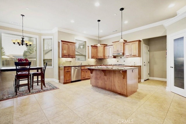 3600 Laver Ct, Redding, CA 96002 - kitchen with stainless steel dishwasher, under cabinet range hood, a center island, a breakfast bar area, and tasteful backsplash