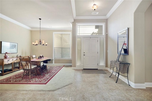 3600 Laver Ct, Redding, CA 96002 - tiled foyer entrance featuring ornamental molding, a chandelier, baseboards, and arched walkways