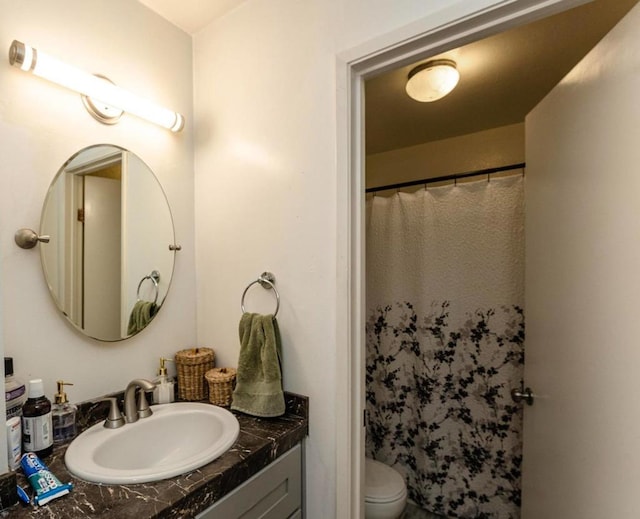 bathroom featuring toilet and sink