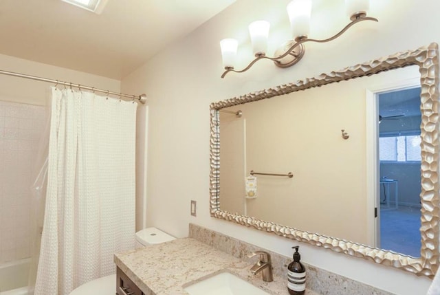 full bathroom with vanity, toilet, and shower / bath combo with shower curtain