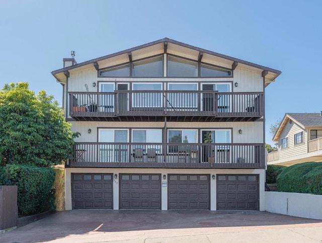 view of front facade with a balcony and a garage