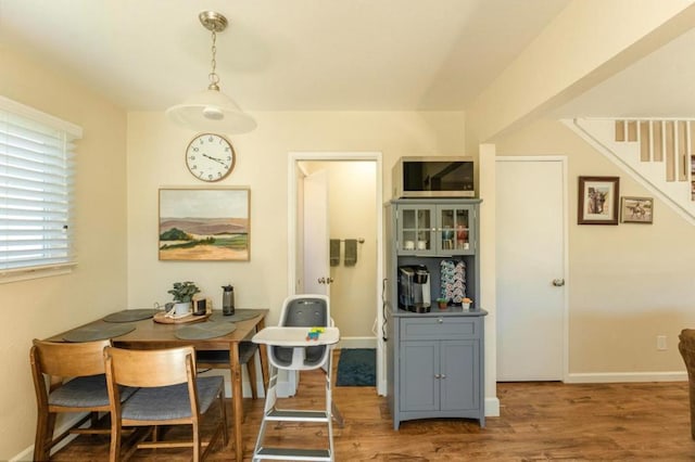 dining room with wood-type flooring