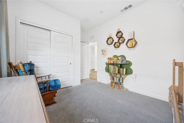 bedroom with carpet and a closet