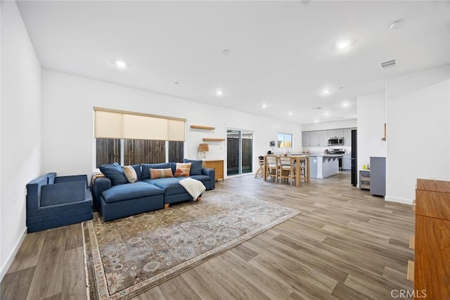 living room featuring light wood-type flooring