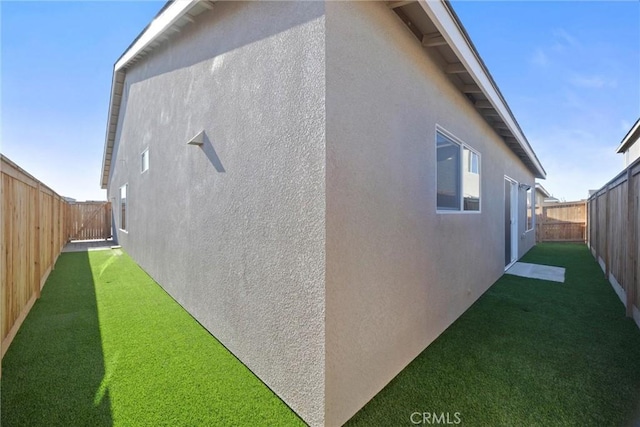 view of home's exterior featuring a lawn