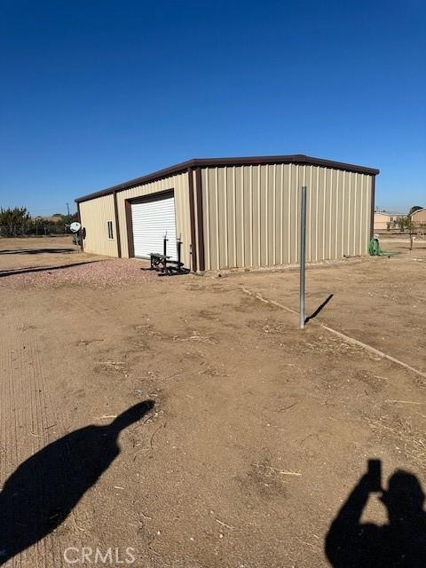 view of outbuilding featuring a garage