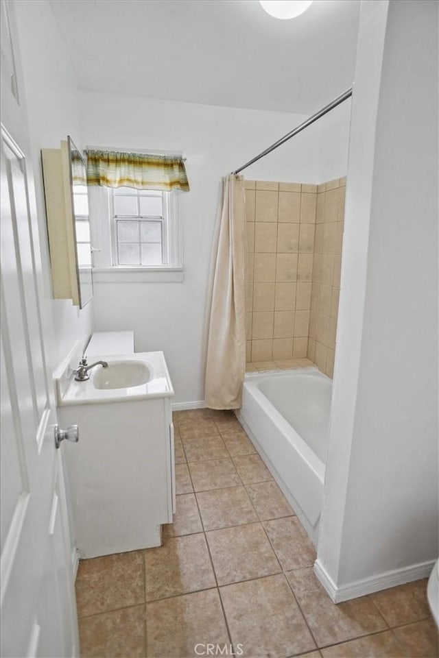 full bath featuring baseboards, shower / bath combo with shower curtain, vanity, and tile patterned floors