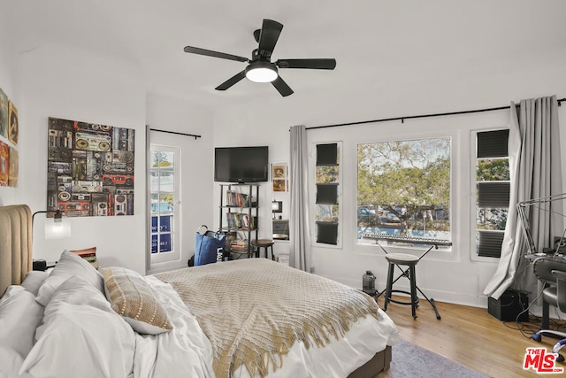 bedroom featuring ceiling fan and light hardwood / wood-style flooring