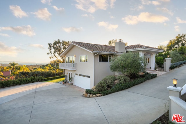 view of side of property featuring a garage