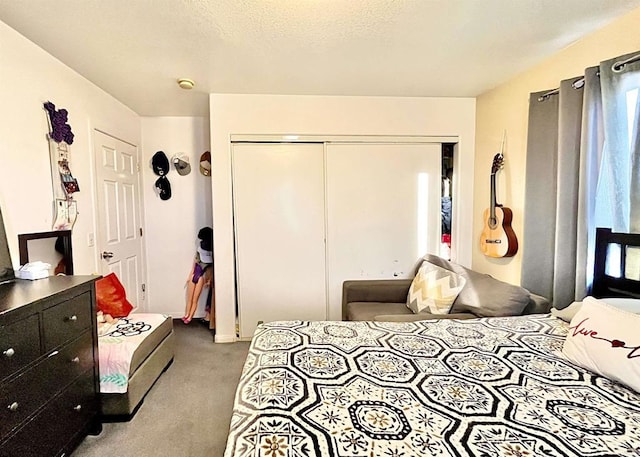 bedroom with light carpet and a closet