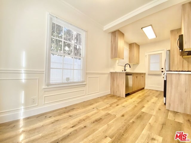 kitchen featuring dishwasher, light brown cabinets, sink, ornamental molding, and light hardwood / wood-style flooring