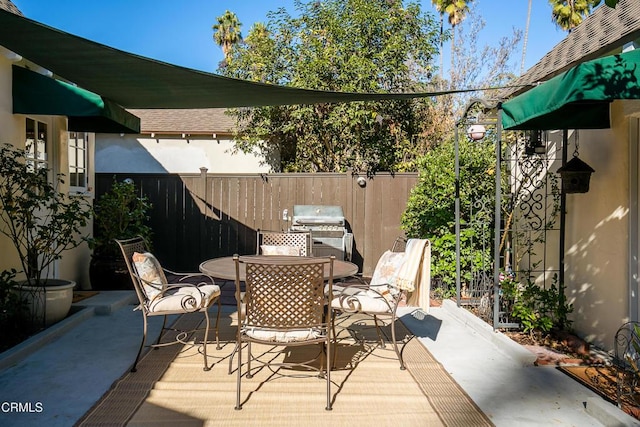 view of patio with a grill