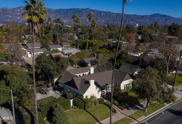 birds eye view of property with a mountain view