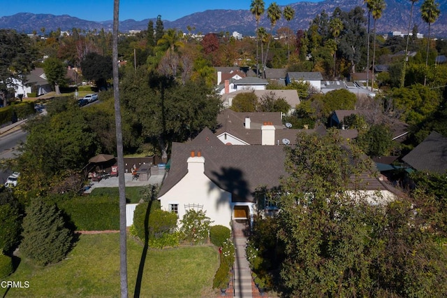 birds eye view of property featuring a mountain view