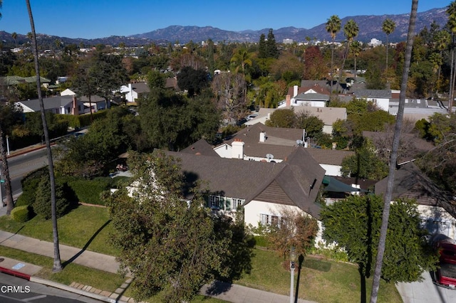 birds eye view of property featuring a mountain view