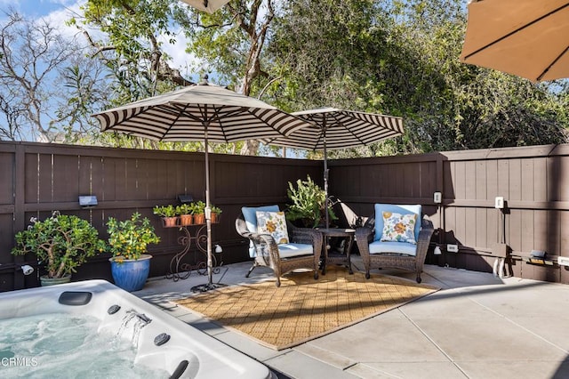 view of patio / terrace featuring a hot tub