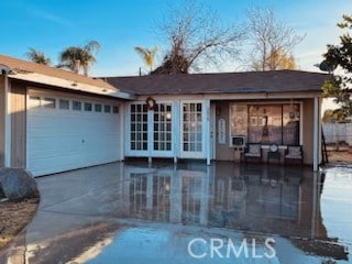 ranch-style home featuring a garage