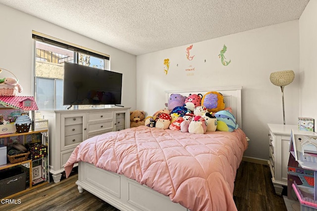 bedroom with dark wood-type flooring and a textured ceiling