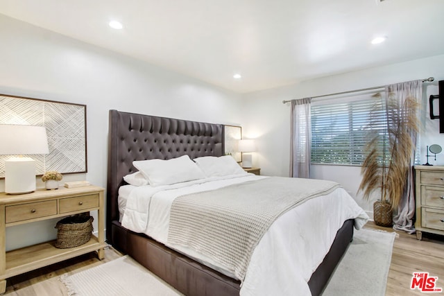 bedroom with light wood-type flooring