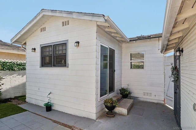 view of side of home with a patio