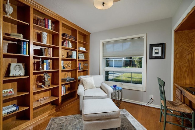 sitting room with hardwood / wood-style floors