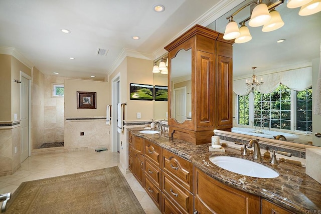 bathroom featuring tile patterned floors, vanity, tile walls, ornamental molding, and a tile shower