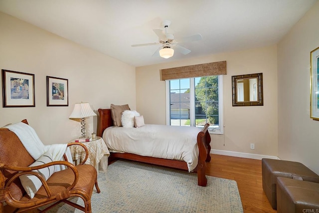 bedroom featuring ceiling fan and light wood-type flooring