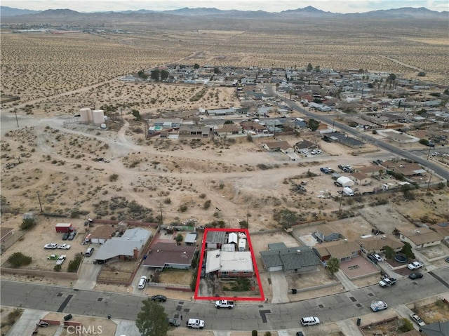 bird's eye view featuring a mountain view and a desert view