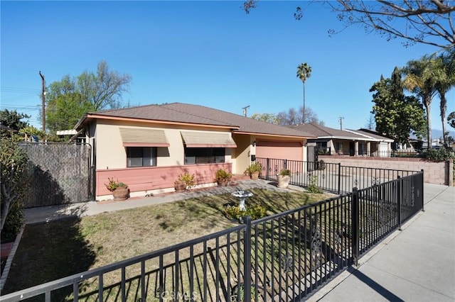 ranch-style home with a front lawn and a garage